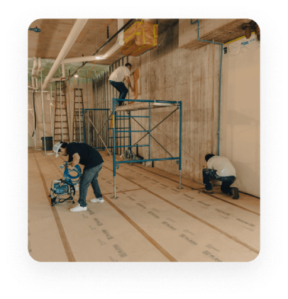 Experts painting interior of a commercial building